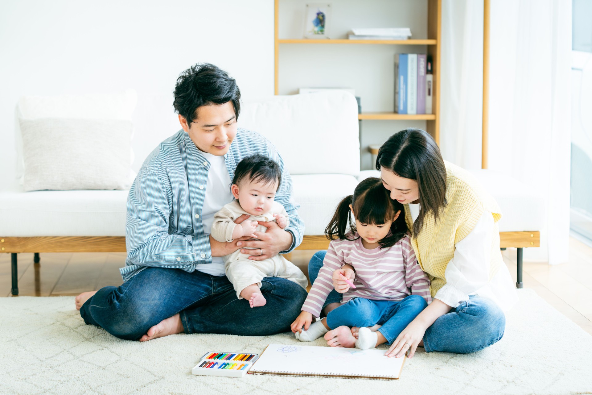 Parent and child drawing in the living room